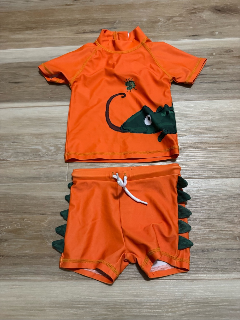 Orange swim outfit with chameleon
